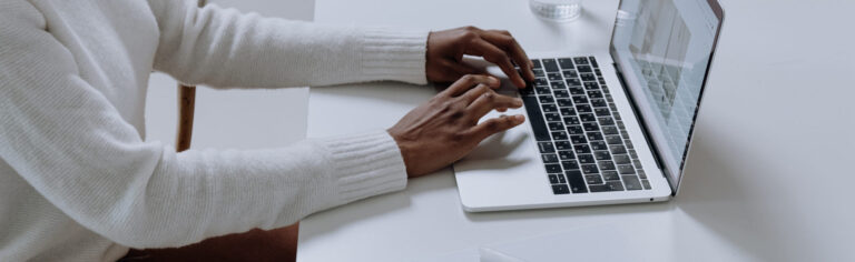 person typing at computer