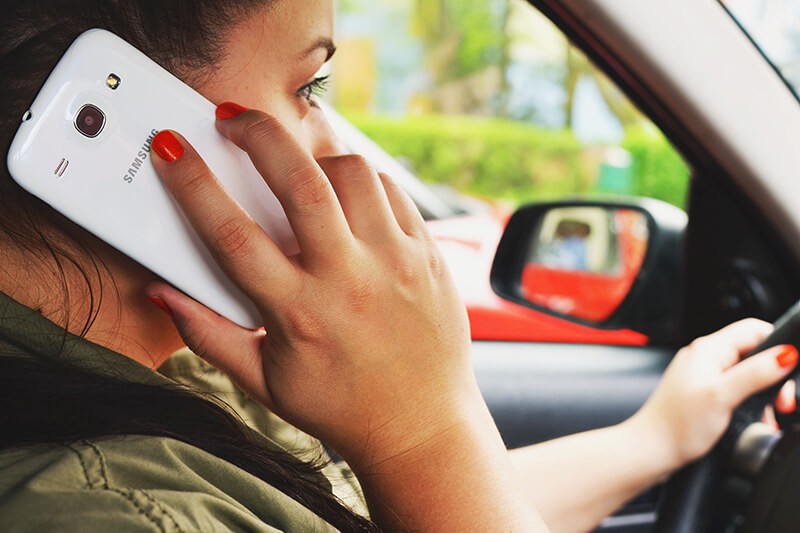 Woman Talking on Cell Phone While Driving