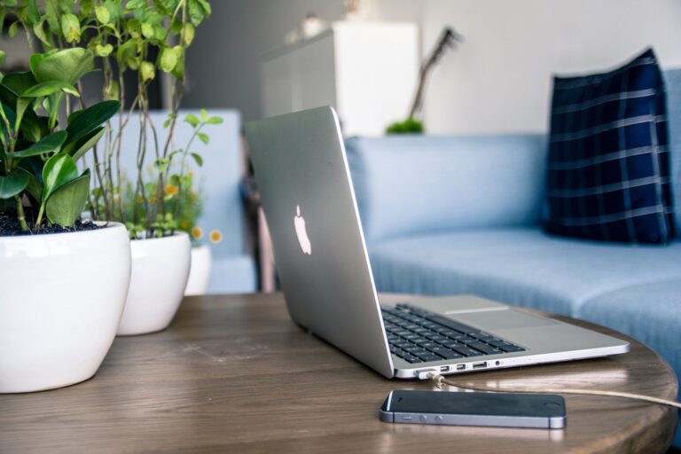 phone and laptop on table
