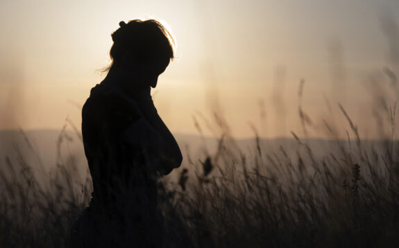 Silhouette of troubled women outdoors